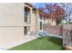 Exterior view of the home with well-maintained lawn, showcasing the architecture and outdoor space at 1312 Georgia Ave # D, Boulder City, NV 89005