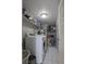 Functional laundry room features modern washer and dryer, with storage shelves for laundry essentials at 1312 Georgia Ave # D, Boulder City, NV 89005