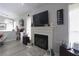 Inviting living room featuring neutral walls, hardwood floors, fireplace, and cozy furniture at 1312 Georgia Ave # D, Boulder City, NV 89005