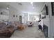 Inviting living room featuring neutral walls, hardwood floors, fireplace, and cozy furniture at 1312 Georgia Ave # D, Boulder City, NV 89005