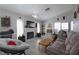 Inviting living room featuring neutral walls, hardwood floors, fireplace, and cozy furniture at 1312 Georgia Ave # D, Boulder City, NV 89005