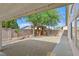 The backyard features decorative gravel landscaping, privacy walls, and a charming wooden gazebo at 1326 Winter Solstice Ave, Henderson, NV 89014
