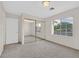 Bright bedroom featuring neutral walls, plush carpet, and a mirrored closet at 1326 Winter Solstice Ave, Henderson, NV 89014