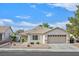 Charming single-story home with well-manicured landscaping, tile roof, and an attached two car garage at 1326 Winter Solstice Ave, Henderson, NV 89014