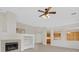 Open-concept living area with fireplace, tile floors, and views of the kitchen and entryway at 1326 Winter Solstice Ave, Henderson, NV 89014