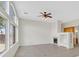Spacious living room with large windows, tile floors, fireplace and built-in shelving at 1326 Winter Solstice Ave, Henderson, NV 89014