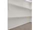 Walk-in closet with carpeted floor and white walls with shelves for ample storage space at 1326 Winter Solstice Ave, Henderson, NV 89014