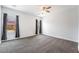 Neutral bedroom featuring new carpet, two windows and a ceiling fan at 2071 Idaho St, Pahrump, NV 89048