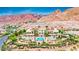 Stunning estate with a private pool, lush landscaping, and picturesque mountain views in a luxury community at 21 Via Visione # 101, Henderson, NV 89011