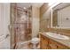 Charming bathroom featuring granite counters, framed shower, and tile floor at 21 Via Visione # 101, Henderson, NV 89011