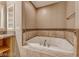 Bathroom featuring a soaking tub with tile surround at 21 Via Visione # 101, Henderson, NV 89011