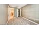 Bright bedroom featuring plush carpeting and a walk-in closet at 21 Via Visione # 101, Henderson, NV 89011