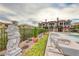 Scenic view of the community pool area with comfortable lounge chairs and beautiful statues in a luxurious environment at 21 Via Visione # 101, Henderson, NV 89011
