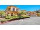 Elegant two-story home featuring a tile roof, manicured landscaping, and a private gated entrance at 21 Via Visione # 101, Henderson, NV 89011