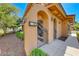 Close-up of a private gated entrance with an address plaque on a tan stucco home at 21 Via Visione # 101, Henderson, NV 89011