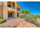Two-story home featuring a patio with columns and balconies, surrounded by landscaping at 21 Via Visione # 101, Henderson, NV 89011
