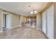 Bright living room with elegant lighting fixtures and adjacent kitchen view at 21 Via Visione # 101, Henderson, NV 89011