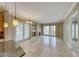 Spacious living room featuring a fireplace and large glass doors at 21 Via Visione # 101, Henderson, NV 89011