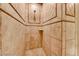 Elegant bathroom shower with decorative tile and built-in shelf at 21 Via Visione # 101, Henderson, NV 89011