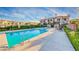Resort-style pool with lounge chairs and manicured hedges in a well-maintained community at 21 Via Visione # 101, Henderson, NV 89011