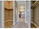 Spacious walk-in closet leading to bright bathroom with vanity at 21 Via Visione # 101, Henderson, NV 89011