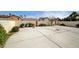 Expansive backyard with mature landscaping, surrounded by a sturdy brick wall for privacy at 2308 Avery Dr, Las Vegas, NV 89108