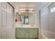 Bathroom featuring double sinks, a large mirror, and a shower-tub combination at 2308 Avery Dr, Las Vegas, NV 89108