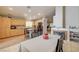 Open-concept dining and kitchen area with tile floors and modern fixtures at 2308 Avery Dr, Las Vegas, NV 89108