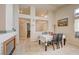 Cozy dining area with fireplace, modern tile flooring, and ample natural light at 2308 Avery Dr, Las Vegas, NV 89108