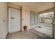 Covered porch with view of security door, concrete columns and desert landscaping at 2308 Avery Dr, Las Vegas, NV 89108