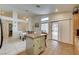 Kitchen with granite countertop island and tile flooring with adjacent dining area at 2308 Avery Dr, Las Vegas, NV 89108