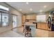 Open kitchen with granite countertops, wood cabinets, and modern appliances at 2308 Avery Dr, Las Vegas, NV 89108