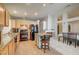 Well-lit kitchen features an island, granite countertops, tile flooring, and modern appliances at 2308 Avery Dr, Las Vegas, NV 89108
