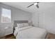 Bright bedroom with a queen bed, nightstands, and light gray walls at 2685 Conifer Canyon St, Henderson, NV 89044