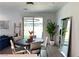 Bright dining area with modern chandelier, sleek mirror, and sliding glass door at 2685 Conifer Canyon St, Henderson, NV 89044