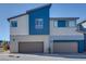 Modern two-story home featuring a stucco exterior and two-car garages at 2685 Conifer Canyon St, Henderson, NV 89044