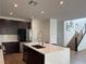 Spacious kitchen featuring quartz countertops, stainless steel appliances, and a central island at 2685 Conifer Canyon St, Henderson, NV 89044