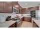 A close-up view of an open kitchen with stainless steel appliances and bright countertops at 2685 Conifer Canyon St, Henderson, NV 89044