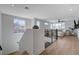 Bright living room features hardwood floors, modern railing, large windows, and ceiling fan at 2685 Conifer Canyon St, Henderson, NV 89044