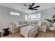 Cozy living room with large sofa, ceiling fan, ample natural light, and modern decor at 2685 Conifer Canyon St, Henderson, NV 89044