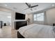 Comfortable main bedroom with wood floors, modern fan and natural light at 2685 Conifer Canyon St, Henderson, NV 89044