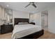 Comfortable main bedroom with wood floors, modern fan and natural light at 2685 Conifer Canyon St, Henderson, NV 89044
