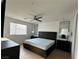 Main bedroom featuring a ceiling fan, sleek furniture, and ample natural light at 2685 Conifer Canyon St, Henderson, NV 89044