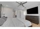Comfortable main bedroom with wood floors, modern fan and natural light at 2685 Conifer Canyon St, Henderson, NV 89044