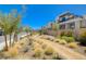 Neighborhood street view with modern homes and beautifully landscaped walking paths at 2685 Conifer Canyon St, Henderson, NV 89044