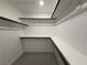 Spacious walk-in closet with extensive shelving and hanging rods for optimal organization at 2685 Conifer Canyon St, Henderson, NV 89044