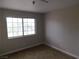 Cozy bedroom with a large window that brings in natural light and carpeted flooring at 2750 S Durango Dr # 2072, Las Vegas, NV 89117