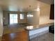Living room featuring an open layout from the kitchen, a fireplace, and access to the balcony at 2750 S Durango Dr # 2072, Las Vegas, NV 89117