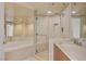 Elegant bathroom showcasing a soaking tub and glass shower, accented by tiled walls at 2777 Paradise Rd # 607, Las Vegas, NV 89109