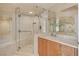 Modern bathroom featuring a glass-enclosed shower, sleek vanity, and tiled walls at 2777 Paradise Rd # 607, Las Vegas, NV 89109